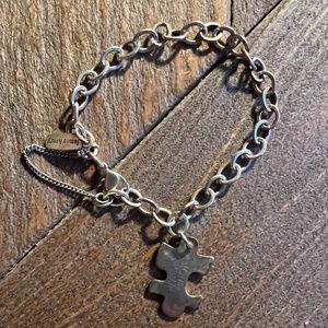 Silver puzzle piece charm and bracelet